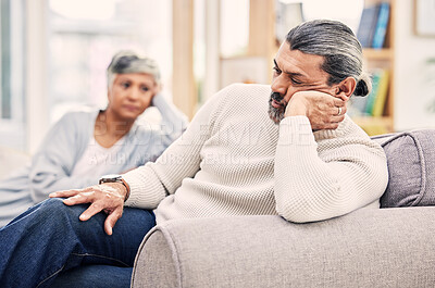 Buy stock photo Senior couple, divorce and fight in disagreement, argument or conflict on living room sofa at home. Elderly woman and man in stress, depression or toxic relationship for cheating affair or breakup