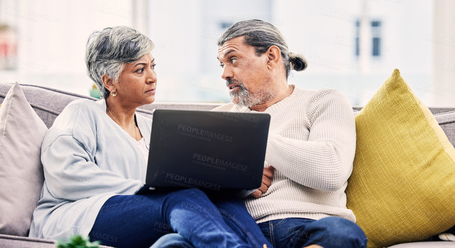 Buy stock photo Senior couple, laptop and serious discussion on sofa for financial planning, budget or debt at home. Elderly man and woman talking with computer for finance, mortgage loan or crisis in living room