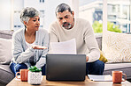 Senior couple, paperwork and stress on laptop with financial documents, taxes or retirement questions at home. Planning debt, computer and people on sofa for life insurance, bills or asset management