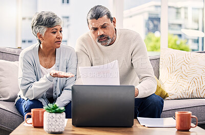 Buy stock photo Senior couple, paperwork and stress on laptop with financial documents, taxes or retirement questions at home. Planning debt, computer and people on sofa for life insurance, bills or asset management