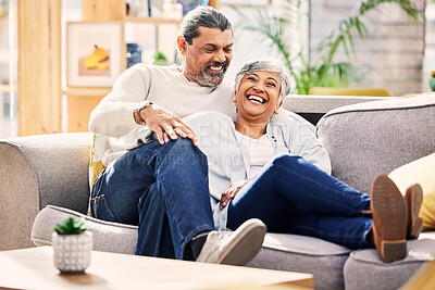 Buy stock photo Home, funny and senior couple on a couch, love or relax with quality time marriage and romance. Romantic, old woman and mature man on a sofa, relationship or happiness with conversation and wellness
