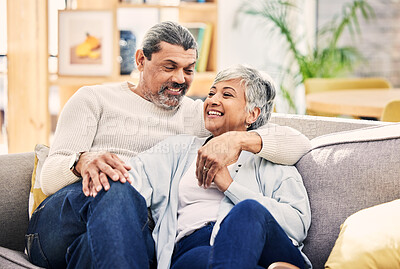 Buy stock photo Home, speaking and senior couple on a couch, love or relax with happiness, marriage or quality time. Romantic, elderly woman or mature man on a sofa, relationship or joy with conversation in a lounge