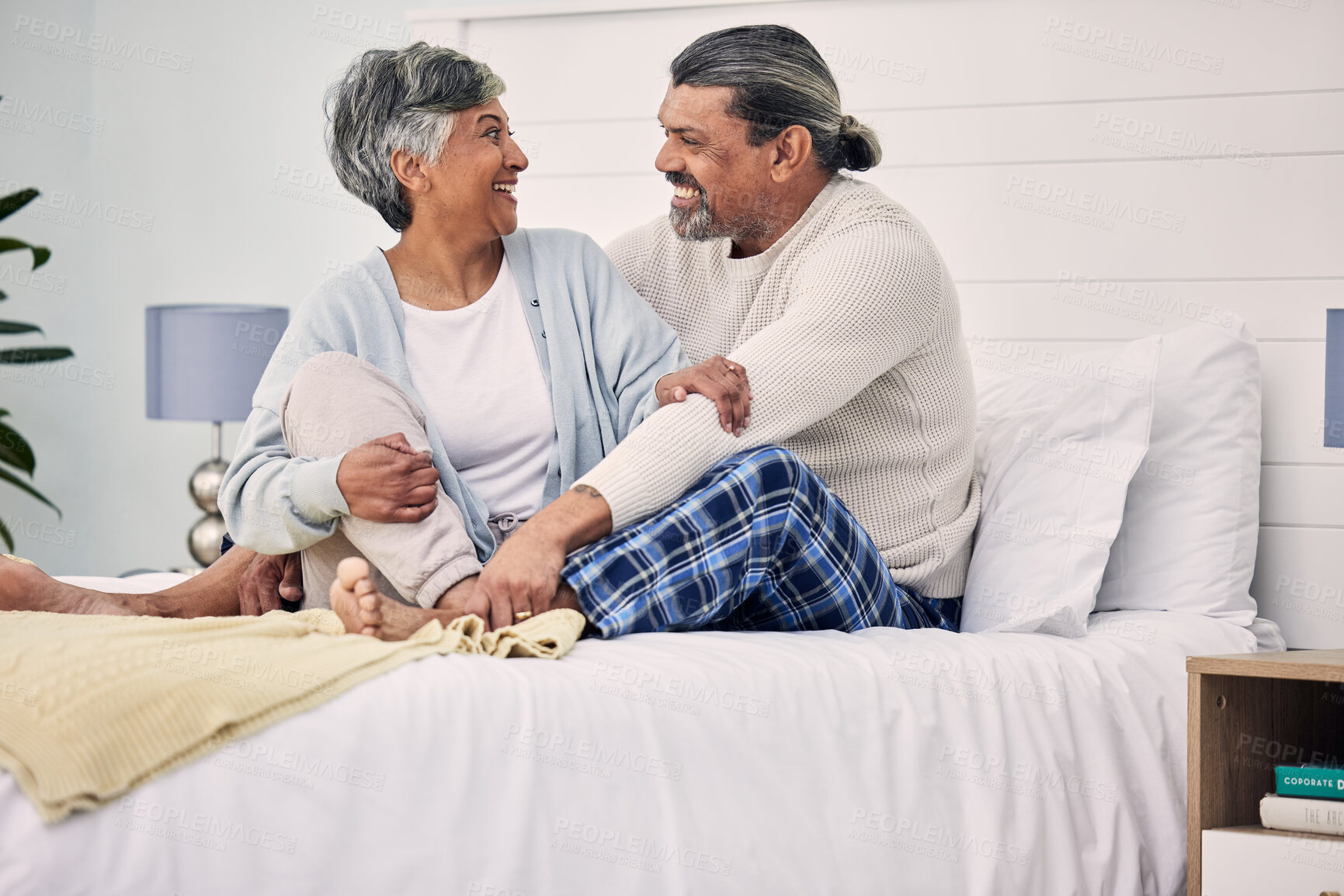 Buy stock photo Old couple in bedroom together, hug with love and comfort, morning routine and happiness with bonding at home. Retirement, relax and communication, marriage and life partner with people in bed