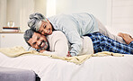 Lying, happy or old couple in bedroom to relax, enjoy romance or morning time together at home. Hugging, senior woman or elderly man laughing or bonding with love, support or smile in retirement 