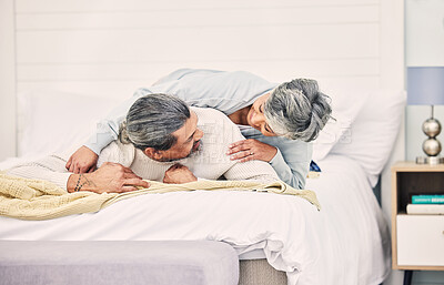Buy stock photo Senior couple, laugh and play on bed in home, hotel and happy together with romance, game and comic joke. Elderly woman, old man and funny on vacation, holiday and relax in bedroom, bonding and love