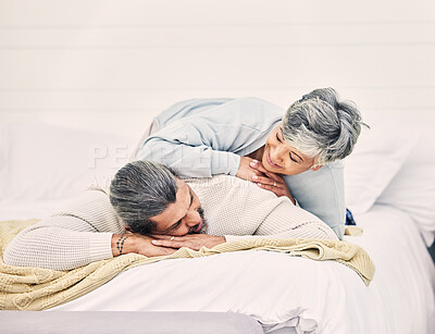 Buy stock photo Happy senior couple, bed and laying in home, hotel and together for romance, chat or conversation in morning. Elderly woman, old man and talk on vacation, holiday or relax in bedroom, bonding or love