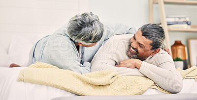 Buy stock photo Lying, funny or old couple in bedroom to relax, enjoy romance or morning time together at home. Hugging, silly senior woman or happy elderly man laughing or bonding with love or smile in retirement