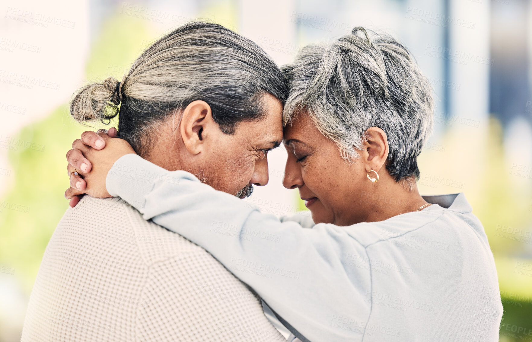 Buy stock photo Love, forehead or old couple hug in home to relax, enjoy romantic holiday or quality time together. Loyalty, senior woman or married elderly man bonding with love, compassion or care in retirement 