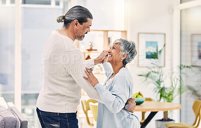 Buy stock photo Senior couple, holding hands and dancing in living room for love, care or bonding together at home. Happy elderly man and woman enjoying quality time, weekend or holiday celebration for anniversary