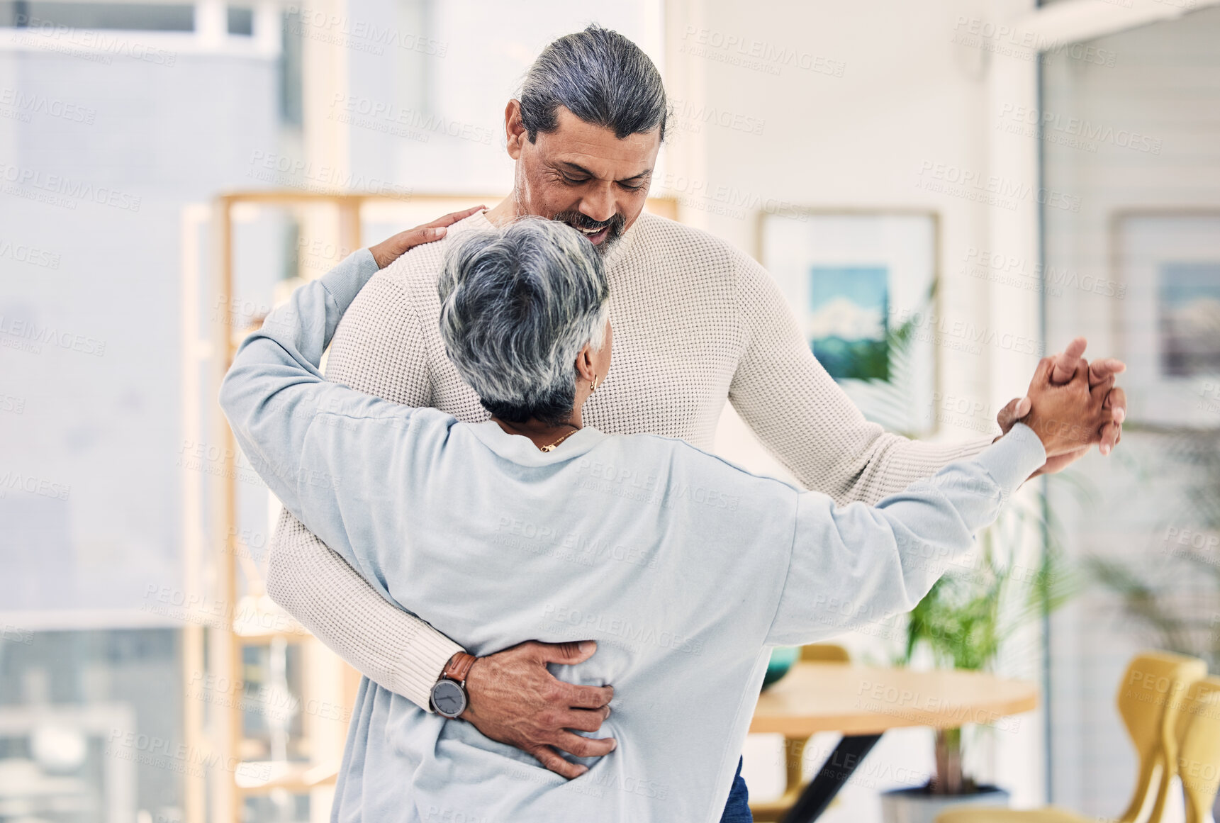 Buy stock photo Senior couple, holding hands and dance in living room for love, care or bonding together at home. Happy elderly man and woman enjoying quality time, weekend or holiday celebration for anniversary