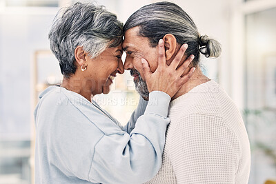 Buy stock photo Hug, forehead and senior couple with love, smile or retirement with happiness, home or loving together. Old woman, happy mature man or embrace in a lounge, quality time or romance with a relationship