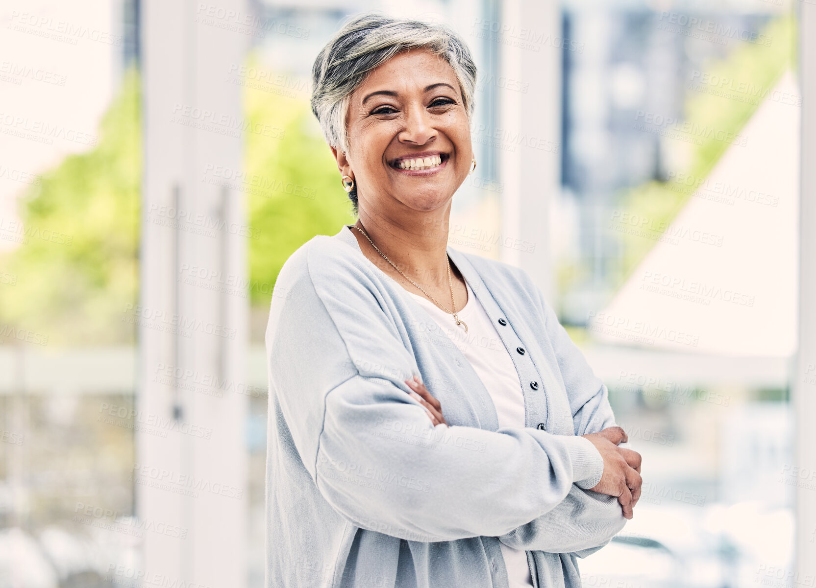 Buy stock photo Portrait, happy and senior woman with arms crossed in house for positive mindset, relax in retirement home and joy. Face, smile and elderly female person from India with confidence in casual clothes.