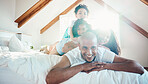 Smile, family and portrait in home bedroom, bonding and sunshine with lens flare. Face, happy and children with father, mother and parents on bed with love, care and quality time to relax together.