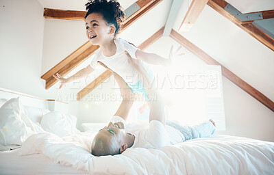 Buy stock photo Man, young girl in air and games in bedroom, airplane and care free with bonding, love and happiness at family home. Father lifting daughter, playing together with fun and playful, trust and flying