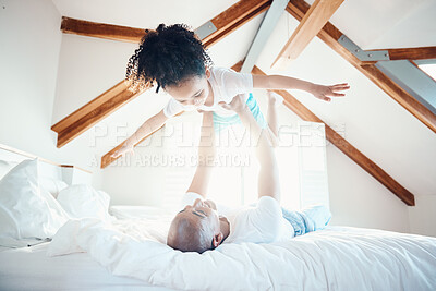Buy stock photo Father, daughter in air and games in bedroom, airplane and care free with bonding, love and happiness at family home. Man lifting young girl, playing together with fun and playful, trust and freedom