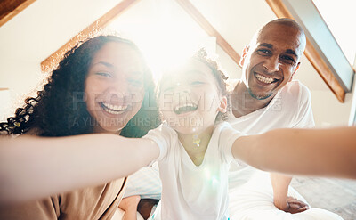 Buy stock photo Family, funny and face selfie in house, bonding and laughing together with sunshine lens flare. Portrait, happy or girl with father, mother and parents with profile picture for memory on social media