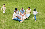 Family, generations and children running on lawn, travel and vacation with parents and grandparents on grass. People outdoor, men and women relax while kids play with adventure and bonding together