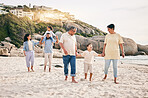 Big family, holding hands and walking at a beach for travel, vacation and fun in nature together. Freedom, parents and children relax with grandparents at the sea on holiday, trip or ocean adventure