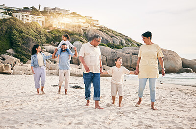 Buy stock photo Big family, holding hands and walking at a beach for travel, vacation and fun in nature together. Freedom, parents and children relax with grandparents at the sea on holiday, trip or ocean adventure
