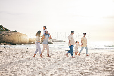 Buy stock photo Holding hands, walking and big family at a beach for travel, vacation and fun in nature together. Freedom, parents and children relax with grandparents at the sea at sunset, trip or ocean holiday