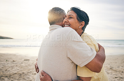 Buy stock photo Hug, love and senior couple at beach happy, relax and bond in nature together. Ocean, embrace and old people hugging at the sea for travel, vacation and enjoy retirement with holiday, freedom or trip