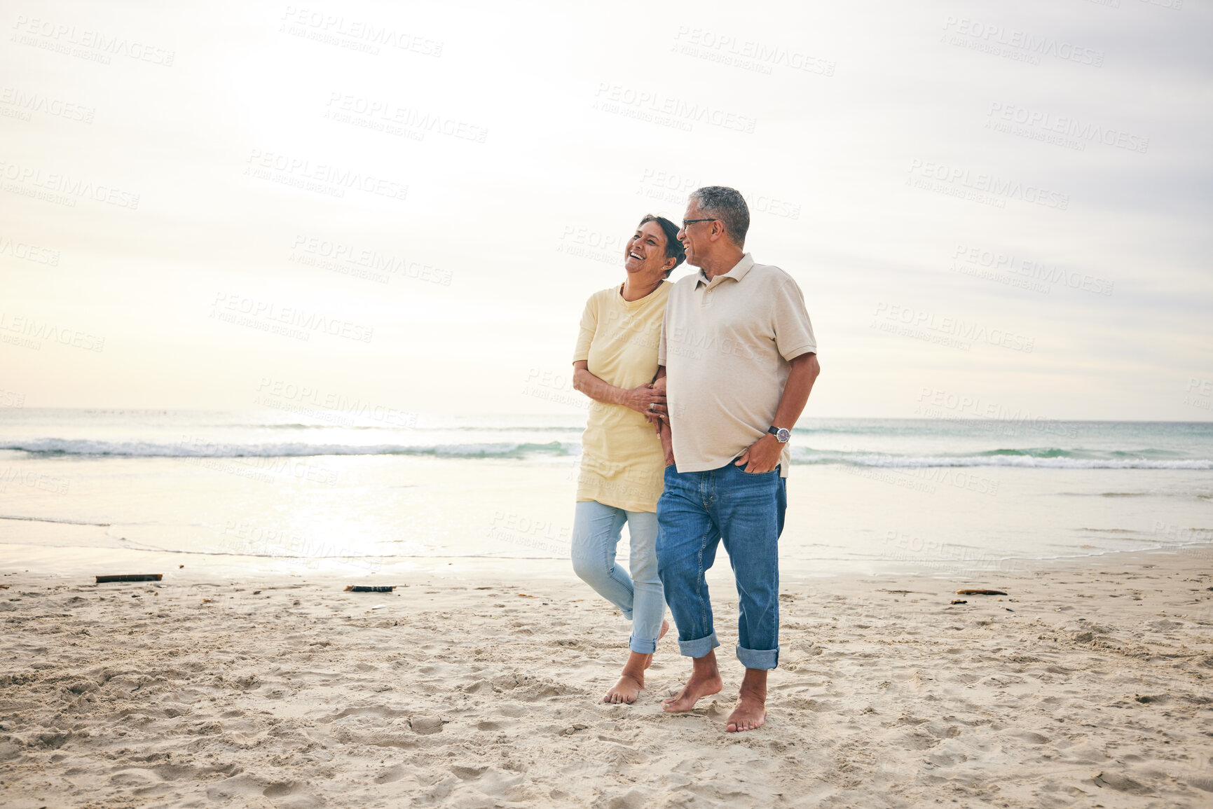 Buy stock photo Walking, love and senior couple at beach happy, relax and bond in nature together. Ocean, embrace and old people at the sea for travel, vacation and enjoy retirement with holiday, freedom or walk