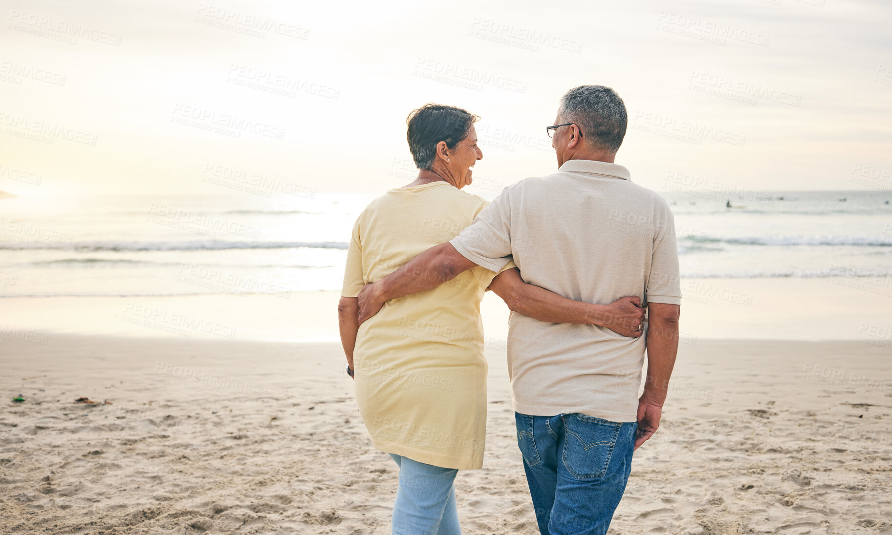 Buy stock photo Beach, hug and rear view of senior couple with love, bond and happy while walking in nature together. Back, embrace and old people enjoy retirement with ocean travel, vacation and holiday at the sea