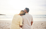 Sunrise, love and senior couple by beach for bonding, quality time and relaxing in nature. Morning, retirement and back of elderly man and woman embrace on vacation, holiday and travel by ocean