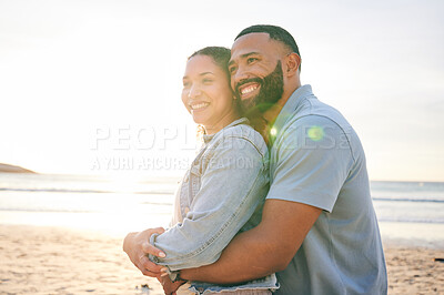 Buy stock photo Hug, beach and couple with love, sunset and marriage with happiness, summer holiday and relationship. Romance, happy man and woman embrace, seaside vacation and relationship with a smile and travel