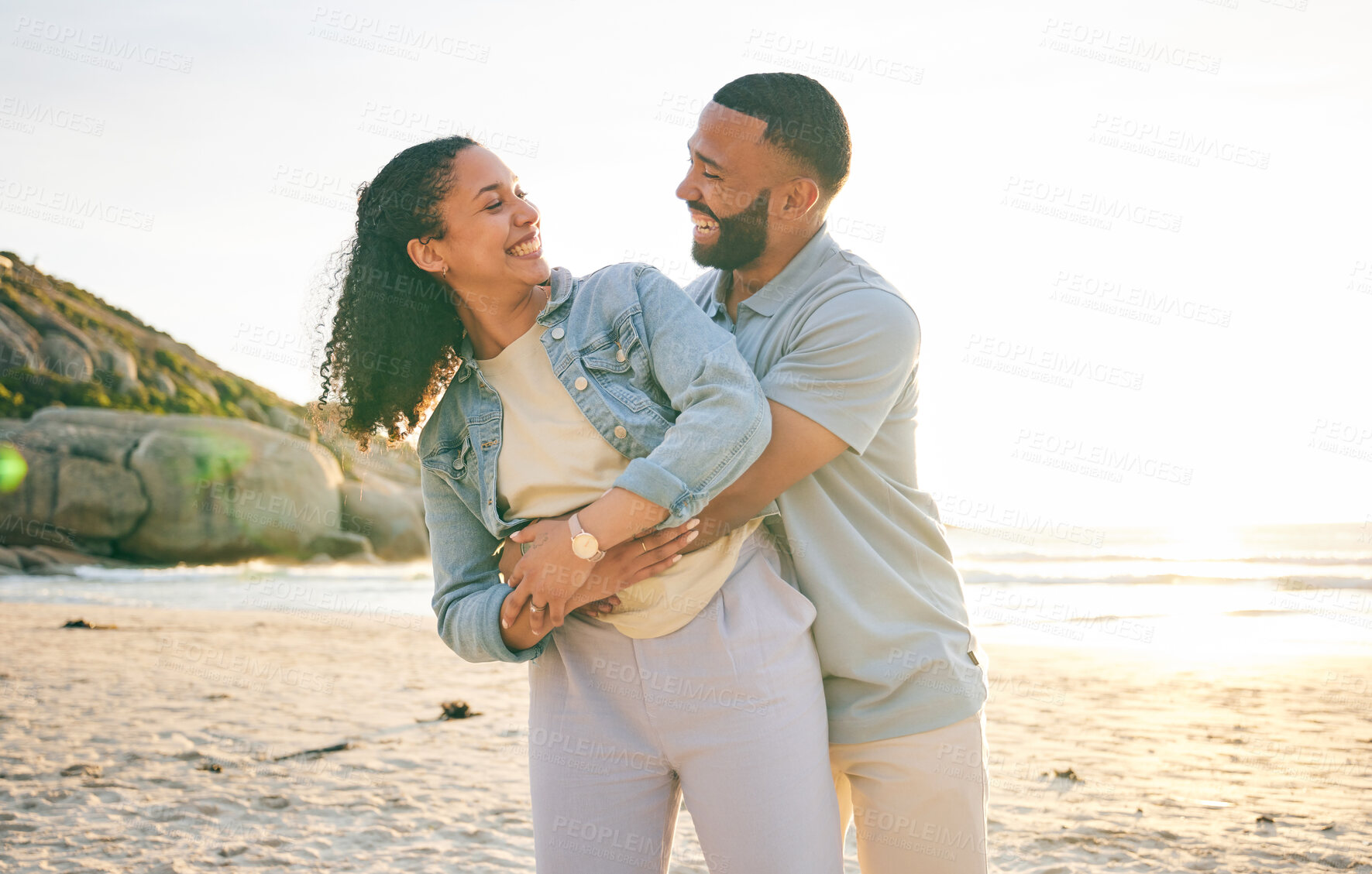 Buy stock photo Hug, beach and couple with love, marriage and quality time with happiness, summer holiday and adventure. Romance, happy man and woman embrace, seaside vacation and relationship with sunset and smile