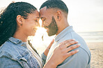Couple, forehead touch and hug, beach and ocean with travel, bonding and love, trust and marriage outdoor. Adventure, holiday and sunshine, man and woman with loyalty and life partner in nature