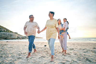 Buy stock photo Grandparents, mother and child, generations and holding hands on the beach, travel and tropical vacation. People outdoor, man with women and young girl, adventure and smile in nature with trust