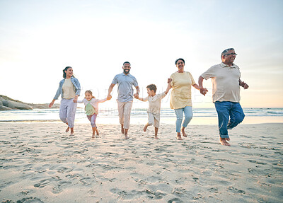 Buy stock photo Trust, family and walking with holding hands on beach with freedom with care on vacation with sunshine. Love, children and generations or parents at ocean together for travel with bonding in summer.