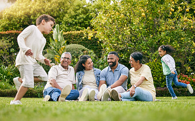 Buy stock photo Picnic, playing children and happy family relax, have fun or enjoy outdoor quality time together, nature and wellness. Summer freedom, grass and bonding grandparents, parents and kids running in park