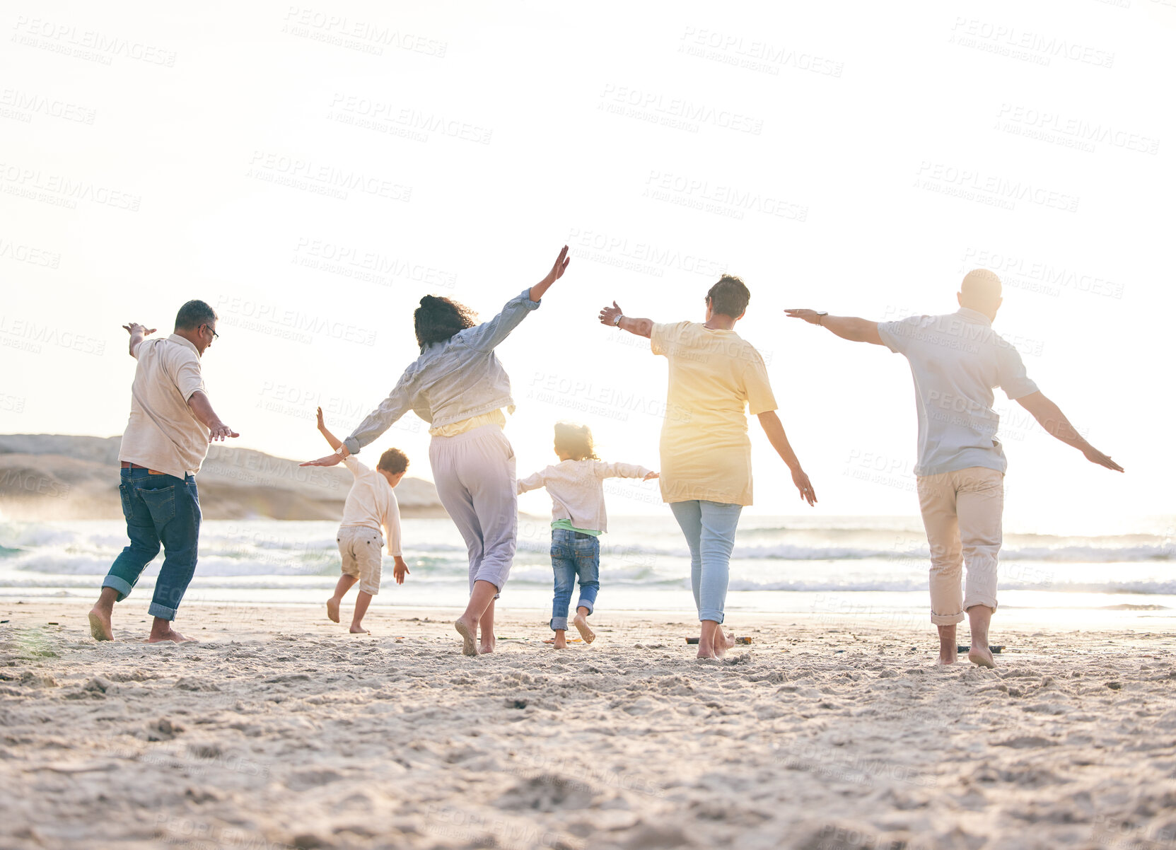 Buy stock photo Airplane, big family and playing at the beach with freedom, fun and bonding with nature rear view. Back, love and children flying with parents and grandparents at the sea for games, holiday or trip