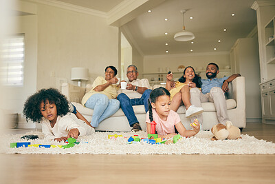 Buy stock photo Big family, toys and playing children with parents and grandparents in lounge at home together for creative fun. Living room, happy and development of kids on carpet floor with games by mom and dad