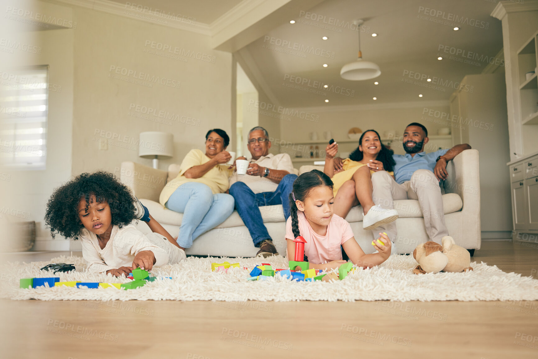 Buy stock photo Big family, toys and playing children with parents and grandparents in lounge at home together for creative fun. Living room, happy and development of kids on carpet floor with games by mom and dad