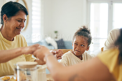 Buy stock photo Family home, lunch and holding hands for praying together, religion or faith with comic girl child at table. Grandmother, kid peeping and prayer for food, celebration or party in house for blessing
