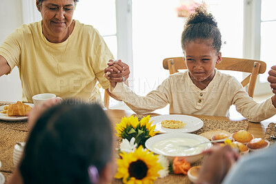 Buy stock photo Praying, parents and child holding hands for lunch, dinner or breakfast together with grandparents at home. Family, religion and mother, dad and girl giving thanks, gratitude and prayer for food