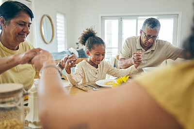 Buy stock photo Family, home and holding hands in prayer while eating at dinner table with grandparents, children and food. Happy people, kids and worship for praying thanks of meal, lunch and respect in dining room