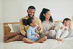 Morning, family and playful with children on bed for happiness on weekend for quality time in home. Fun, father and mother with kid together in bedroom with love or laugh and care with bonding.