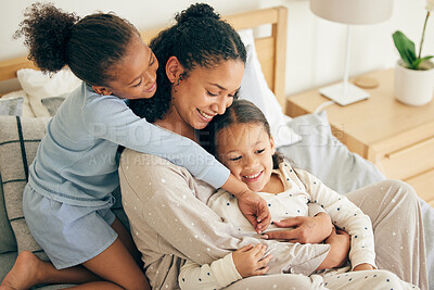 Buy stock photo Mother, home and children hug or happy with parent together in the morning laughing in a bedroom on a bed. Funny, bonding and mom enjoy quality time with kids or girls with happiness and love