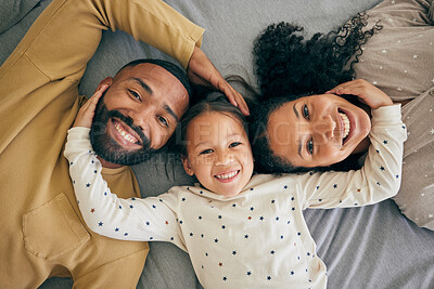 Buy stock photo Happy family, top view and child relax or happy with parents together in the morning laughing in a bedroom on a bed. Smile, mom and dad enjoy quality time with kid with happiness, bonding and love