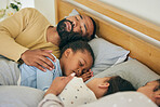 Sleeping, comfort and family in bed relax, resting and dreaming in their home together. Peaceful, sleep and parents embrace children in bedroom for nap, relaxation or cozy, love and sweet on weekend