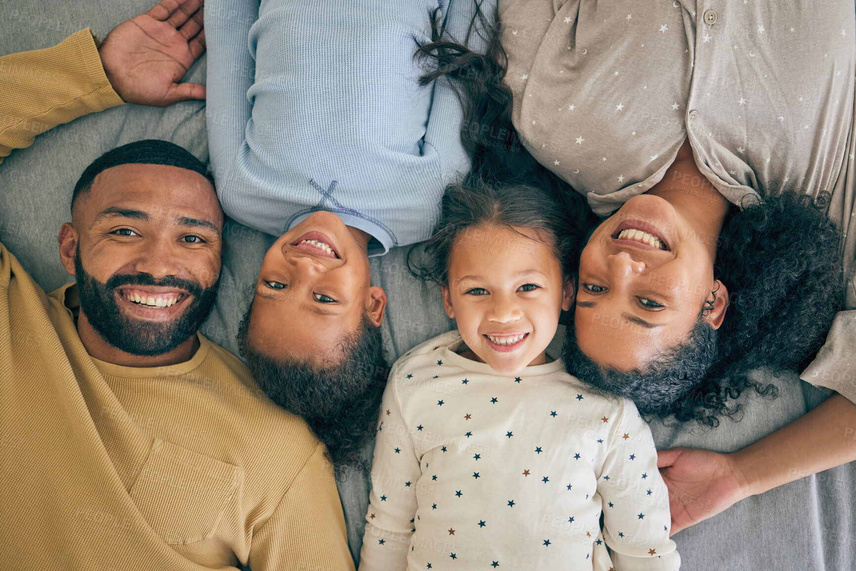 Buy stock photo Happy family, bed and portrait of children relax or happy with parents together in the morning in a bedroom. Smile, dad and mom enjoy quality time with kids or girls with happiness, care and love