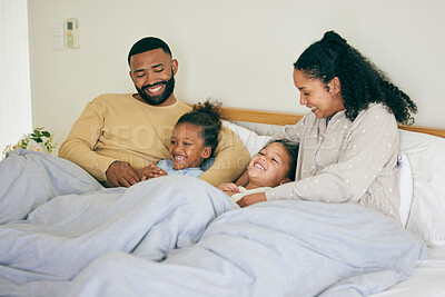 Buy stock photo Happy family, wake up and playing in bed in the morning, bond and having fun in their home together. Love, bedroom and parents with children and tickle, game and laugh, play and cuddle on the weekend