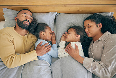 Buy stock photo Sleeping, family and relax in bed from above, relax and resting in their home on the weekend. Sleeping, comfort and top view of parents embracing children in a bedroom with love, nap and dreaming
