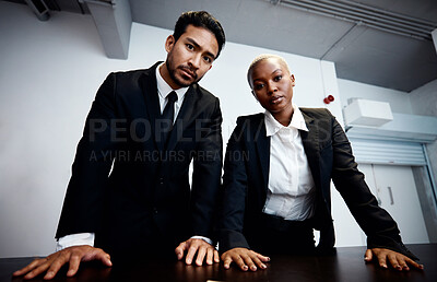 Buy stock photo Police detective, man and woman in interrogation room, portrait and together with teamwork for information. Government agent, face and investigation for legal questions, law and justice to stop crime