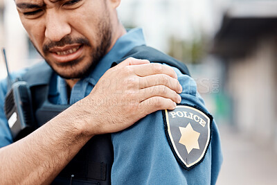 Buy stock photo Shoulder pain, man or police officer with injury from accident crime, crisis danger or gunshot emergency in city. Law, arm or injured security guard with painful joint, inflammation or wound in town