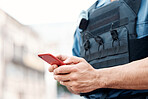 Man, police and hands with phone for communication, networking or social media in the city. Closeup of male person or officer typing, texting or chatting on mobile smartphone app in an urban town